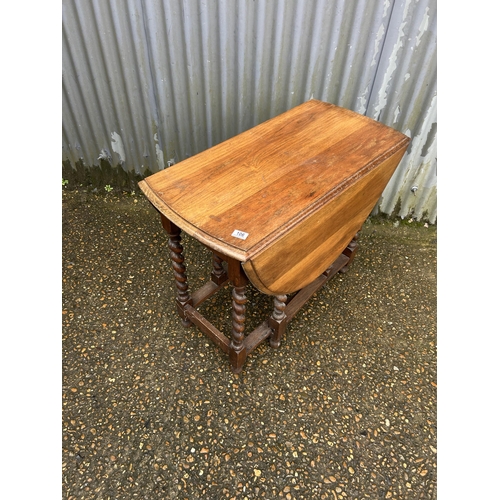 106 - An oak barley twist gate leg table