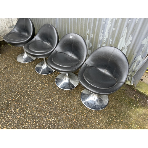 113 - A set of four black vinyl and chrome stools by Johanson design