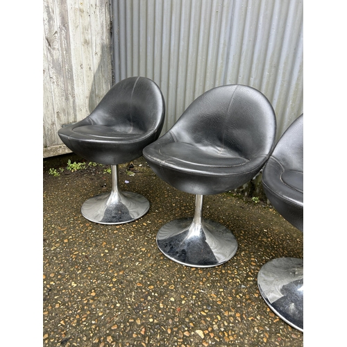 113 - A set of four black vinyl and chrome stools by Johanson design