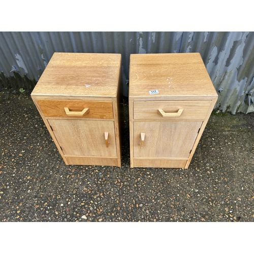 117 - A pair of mid century light oak g plan or similar bedside cupboards