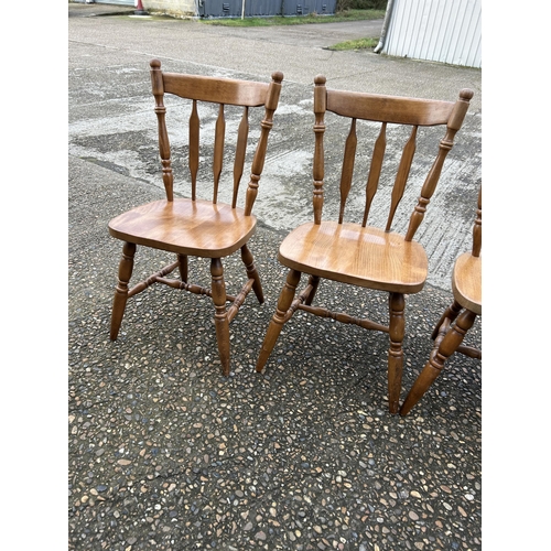 119 - A set of four kitchen chairs