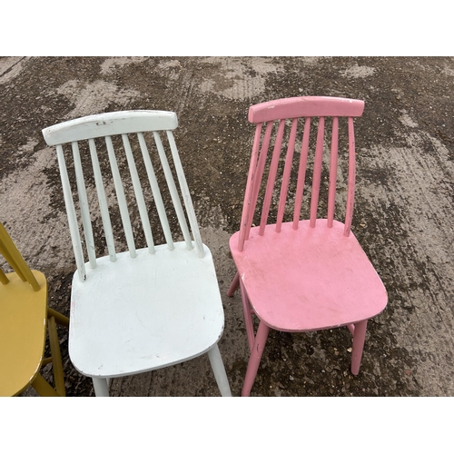 127 - Four painted stick back chairs