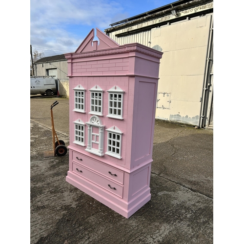 132 - A very large nursery wardrobe, styled as a dolls house 126x40x215