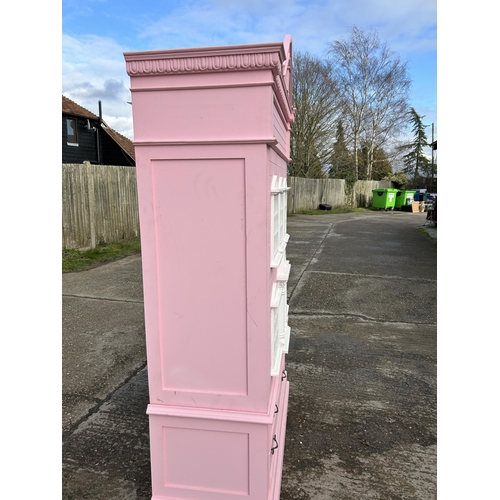 132 - A very large nursery wardrobe, styled as a dolls house 126x40x215