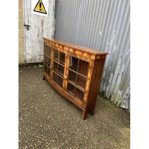 134 - A reproduction mahogany bow front cabinet 150x28x96