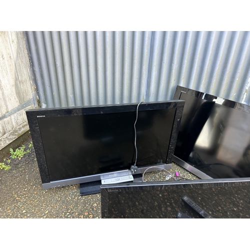 136 - A collection of five assorted flat screen tvs with remotes