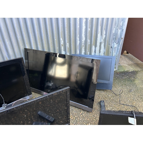 136 - A collection of five assorted flat screen tvs with remotes