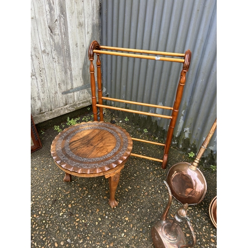 144 - Airer, carved table, two warming pans, kettle and brass lamp