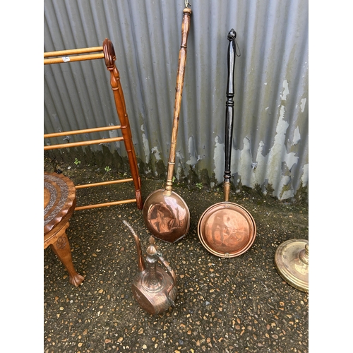 144 - Airer, carved table, two warming pans, kettle and brass lamp