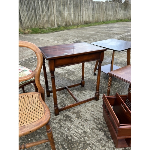 146 - A collection including four tables, two magazine racks, and two chairs