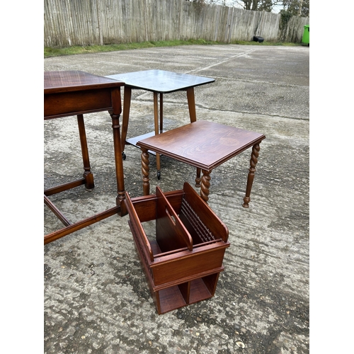 146 - A collection including four tables, two magazine racks, and two chairs