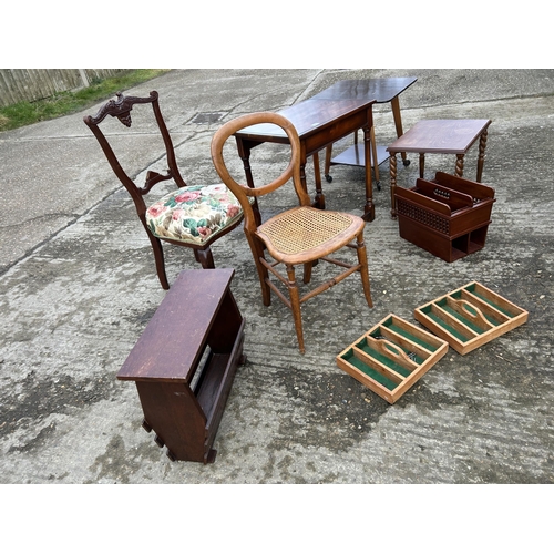 146 - A collection including four tables, two magazine racks, and two chairs