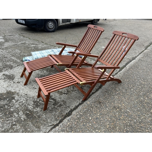 151 - A pair of good quality hardwood steamer style lounger chairs with cushions