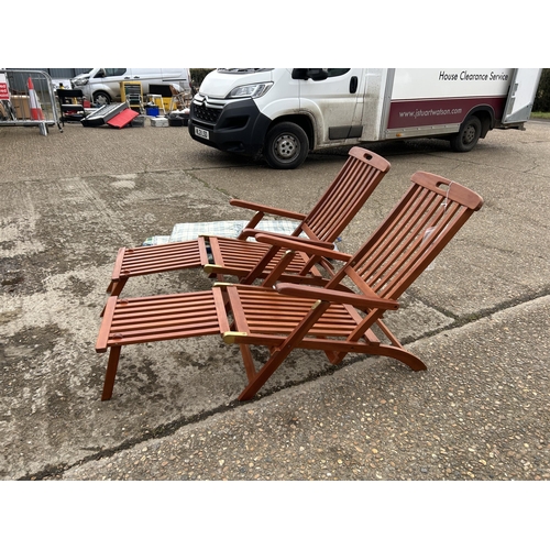 151 - A pair of good quality hardwood steamer style lounger chairs with cushions