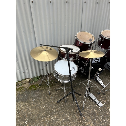 155 - A collective drum set and drum parts, cymbals etc