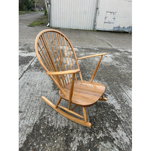 163 - An ercol light elm stick back rocking chair, recently refurbished