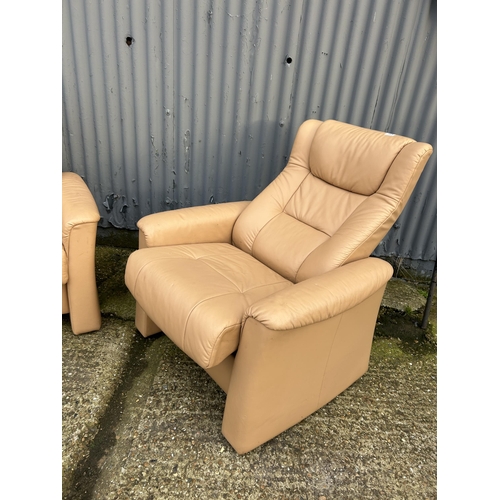 165 - A pair of FJORDS cream leather reclining armchairs