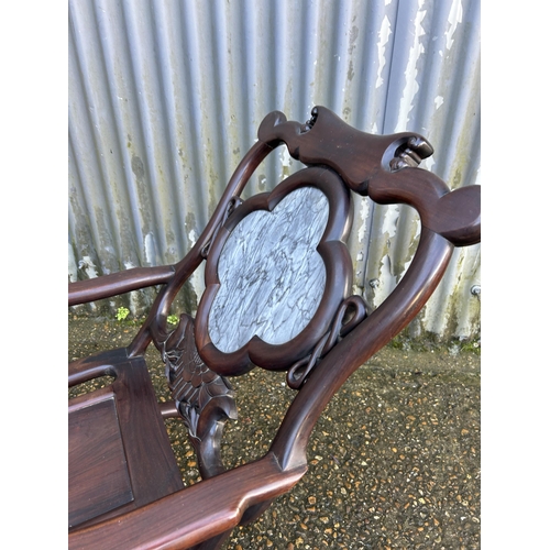 187 - An oriental  hardwood chair with a marble panel back