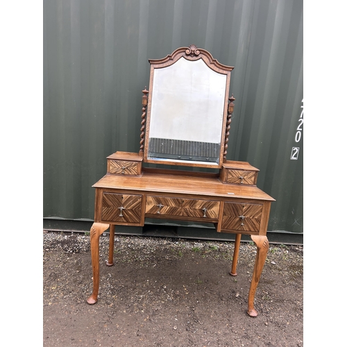 19 - A continental walnut three drawer dressing table