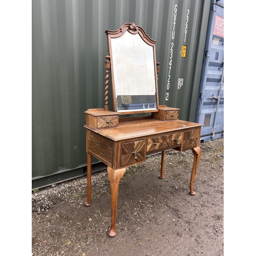 19 - A continental walnut three drawer dressing table