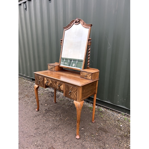 19 - A continental walnut three drawer dressing table