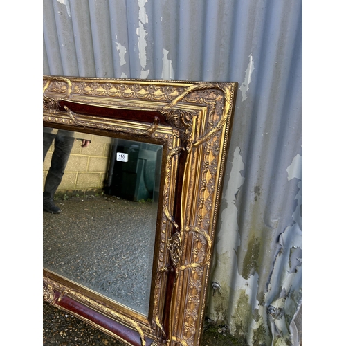 190 - A highly ornate gold gilt framed mirror 128x100