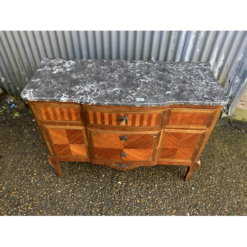 191 - A French kingwood chest of three drawers with grey marble top 120x50x85