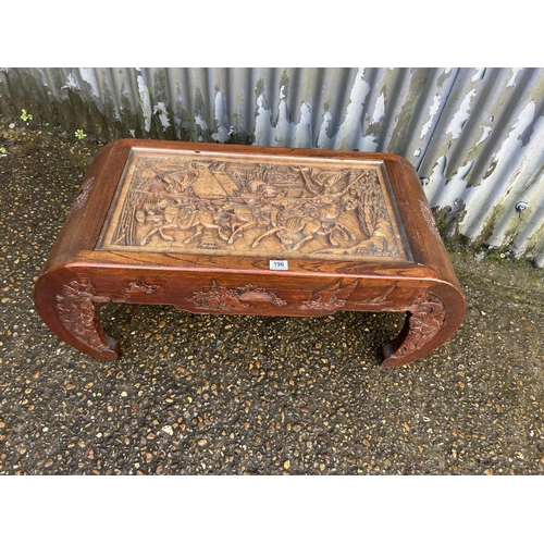 196 - A carved camphor wood coffee table 99x44x40