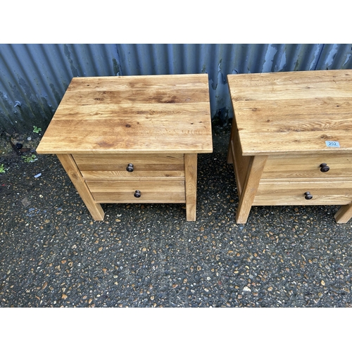 202 - A pair of light oak two drawer bedsides