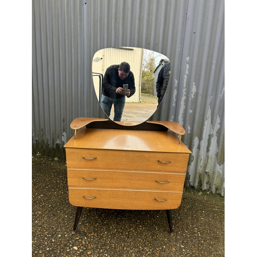 206 - A mid century light oak dressing chest