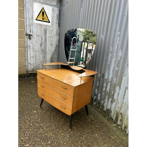 206 - A mid century light oak dressing chest