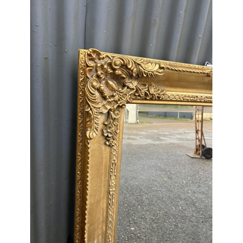 207 - An ornate gold gilt framed mirror 83x112