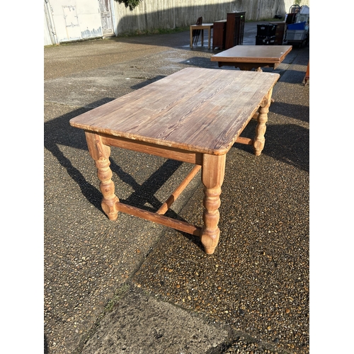 231 - A farmhouse pine dining table  with stretcher base 168x90x77