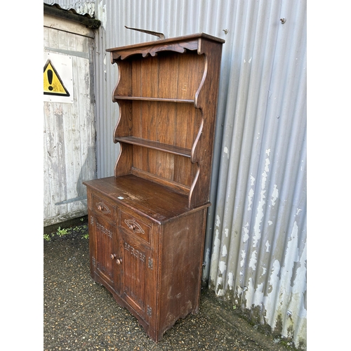 233 - A carved oak dresser 90cm wide