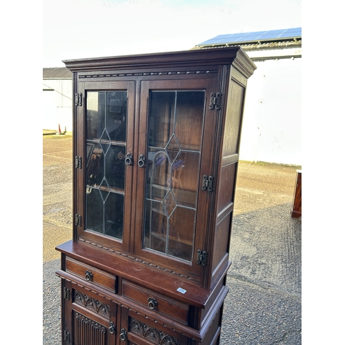 235 - A old charm, leaded  oak bookcase cupboard  93x45 x188