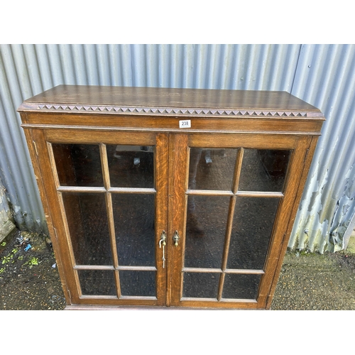 238 - A glazed oak cabinet 103x33x140