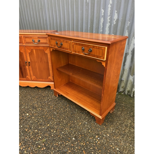 258 - Repro yew two drawer cupboard together with matching two drawer bookcase