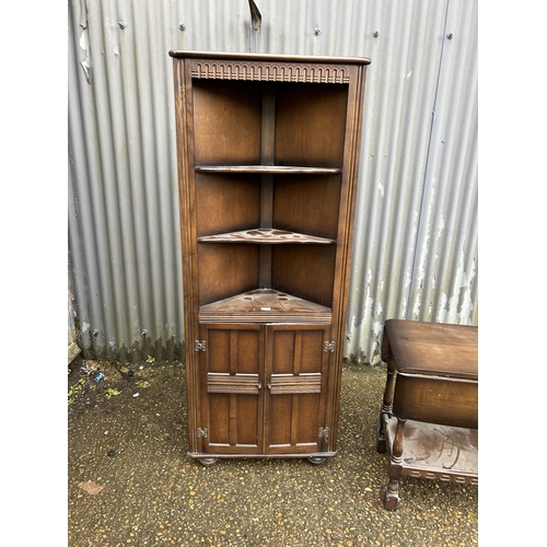 273 - A oak corner cupboard together with oak drop leaf trolley