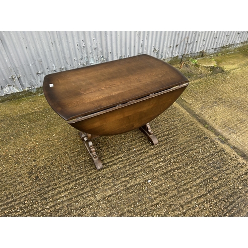 275 - Dark ercol drop leaf kitchen table