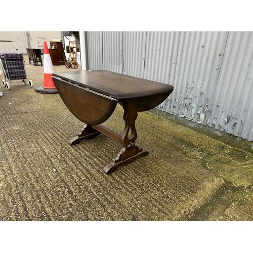 275 - Dark ercol drop leaf kitchen table