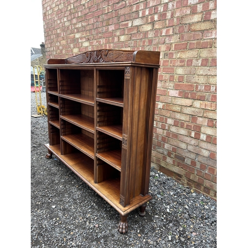 30 - A good quality solid carved mahogany bookcase with adjustable shelves  166x30x150