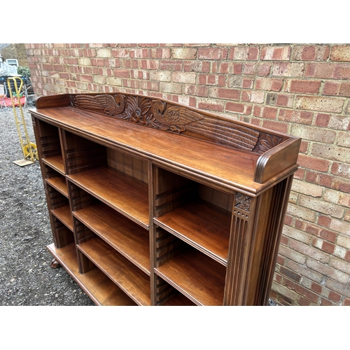 30 - A good quality solid carved mahogany bookcase with adjustable shelves  166x30x150