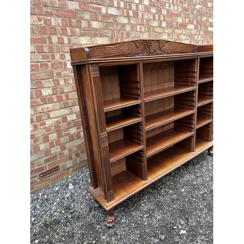 30 - A good quality solid carved mahogany bookcase with adjustable shelves  166x30x150