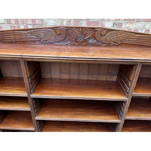 30 - A good quality solid carved mahogany bookcase with adjustable shelves  166x30x150