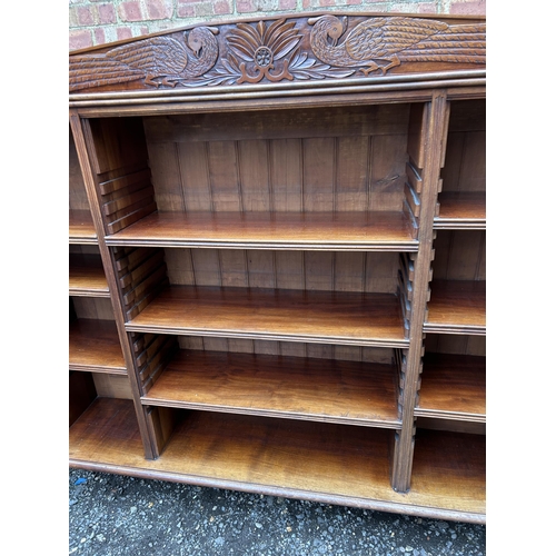 30 - A good quality solid carved mahogany bookcase with adjustable shelves  166x30x150