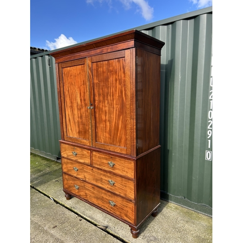 307 - A Victorian mahogany linen press with five slides to the top over five drawer base 136x58x210