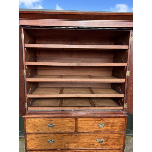 307 - A Victorian mahogany linen press with five slides to the top over five drawer base 136x58x210