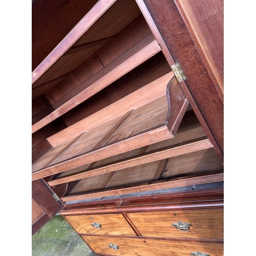 307 - A Victorian mahogany linen press with five slides to the top over five drawer base 136x58x210