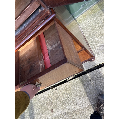 307 - A Victorian mahogany linen press with five slides to the top over five drawer base 136x58x210