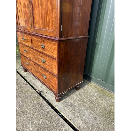 307 - A Victorian mahogany linen press with five slides to the top over five drawer base 136x58x210